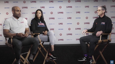 Basketball coaches Stan Johnson and Aarika Hughes talk with LMU President Timothy Law Snyder