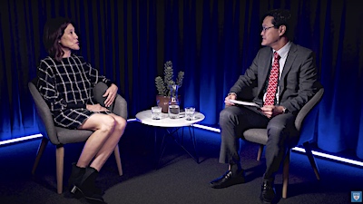 Provost Tom Poon talking with film and television professor Janet Yang